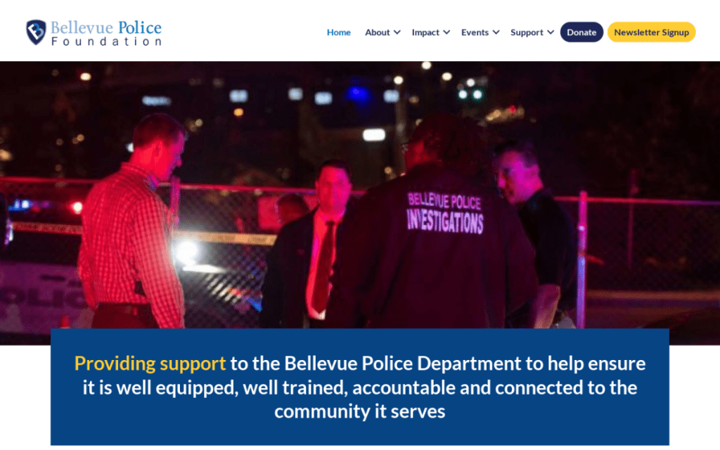 Four individuals, including one in a "Bellevue Police Investigations" jacket, stand together at night under red and blue lights near a police line—an unexpected backdrop for a unique web design portfolio feature.