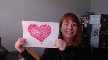 WebCami holding a heart and sending love to clients and friends