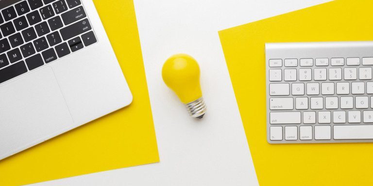 A light bulb and computer - generating ideas.