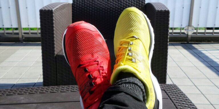 pair of red-and-yellow sneakers