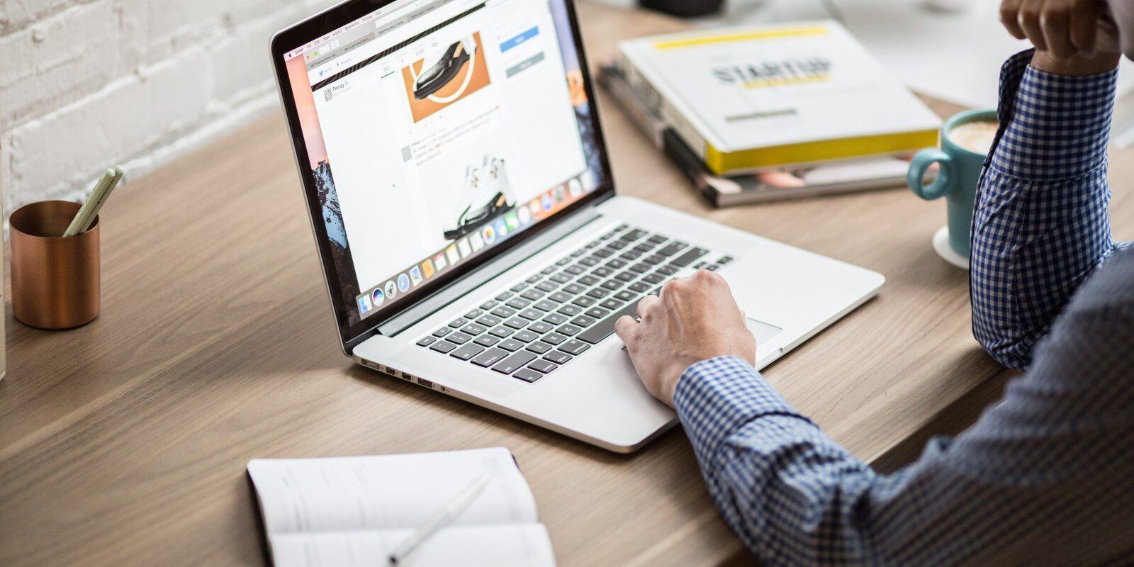 A person viewing a website on a laptop