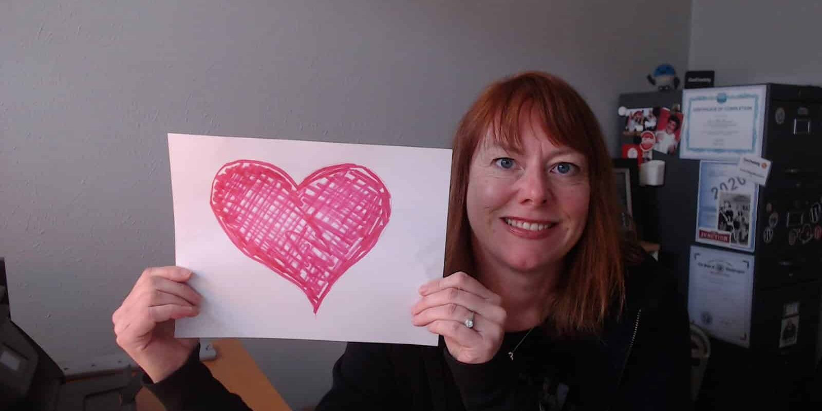 WebCami holding a heart and sending love to clients and friends